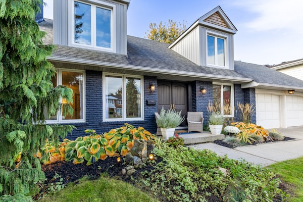 Beautiful residential home with vibrant landscaping and curb appeal